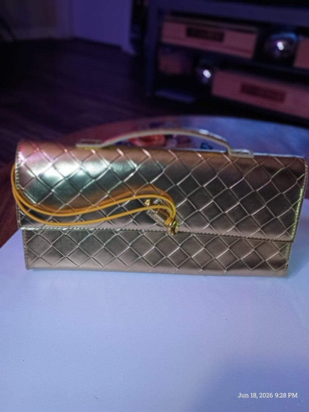 Gold woven look clutch